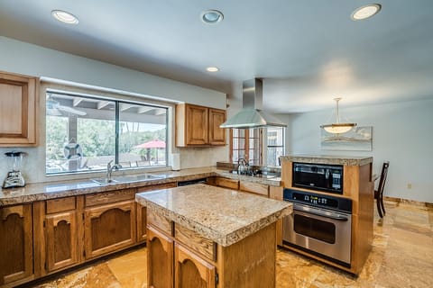 Full kitchen with stainless steel appliances