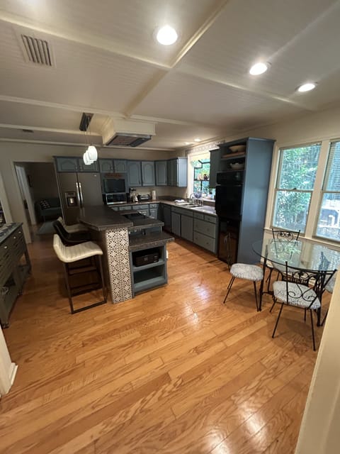 Kitchen with island seating and cafe table