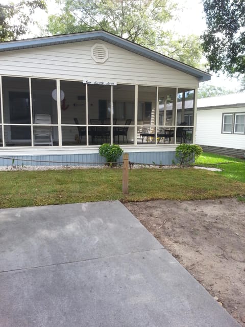 Front of house with screened porch