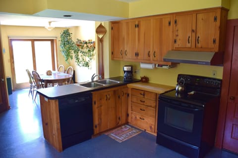 Kitchen with all modern appliances. Dining area has great sunset views.