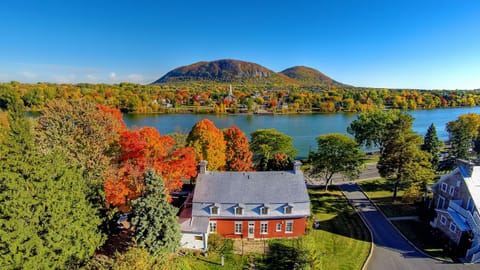 Drone view of the property with beautiful Mont Saint-Hilaire and the river