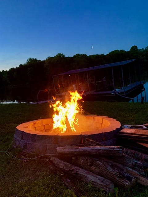 Firepit at lakes edge in front of your boat dock

