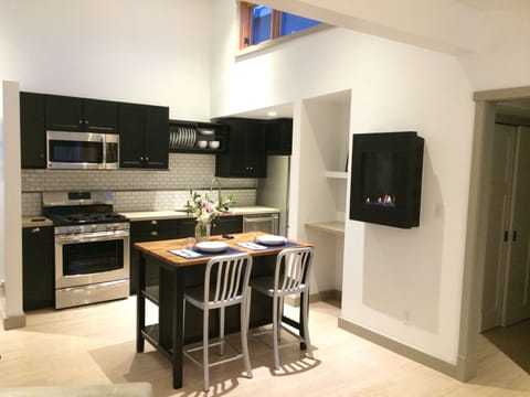 Kitchen, island and gas fireplace