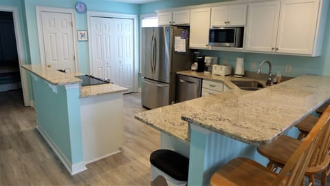 Kitchen is fully equipped. Laundry area and pantry.