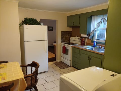 Kitchen with enrty room visible 