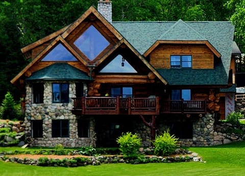 Hand scribed and real rock home in a calm bay