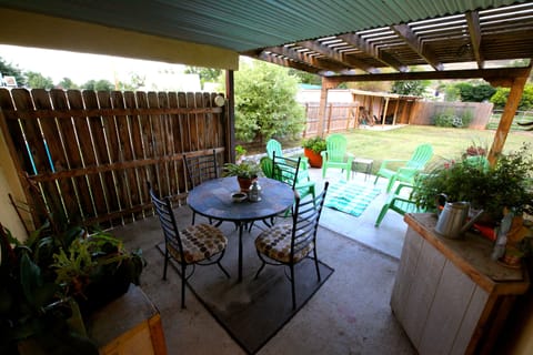 Covered outdoor dining table on patio