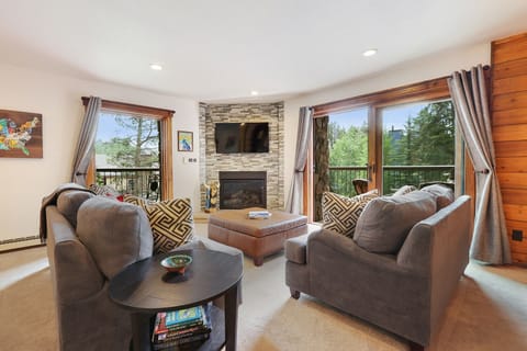Bright & sunny living room with balcony to enjoy your morning coffee.