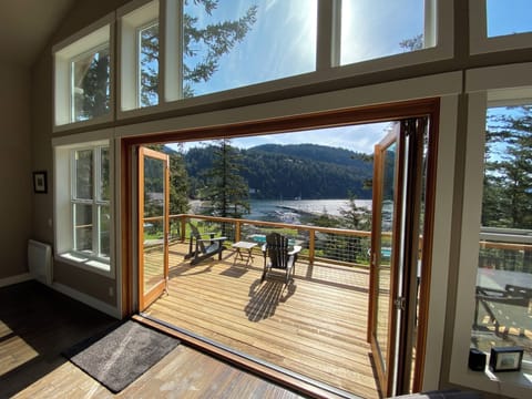 Upper deck of living room with 12’ bi-folding doors open 

