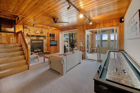 Lower level living area with gas fireplace and walkout to the outdoor patio