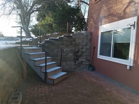 6 non slip steps to patio of daylight basement, also handrails