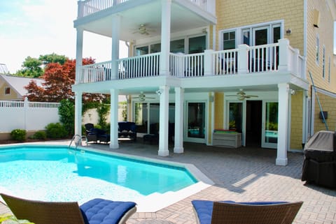 Shaded patio and gas grill.
