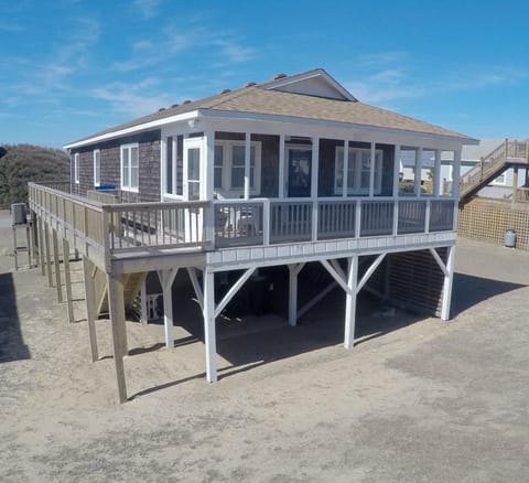 The screened-in porch faces the ocean - relax and enjoy the breezes and view!