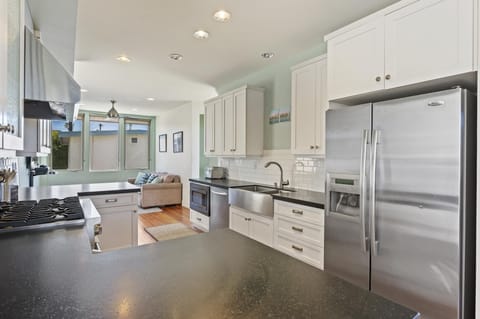 Gourmet kitchen with double bar area on each end.