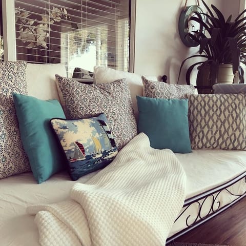 Daybed in sunroom ~ perfect for reading or an extra guest. 