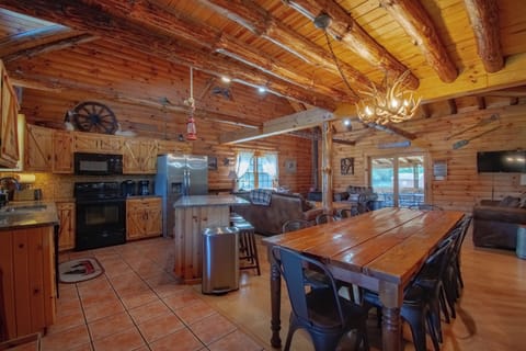 Gather on the main floor! 8-10 at kitchen table, 3  at island, 4 at pub table