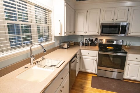 A roomy and well stocked kitchen makes meal prep easy. 