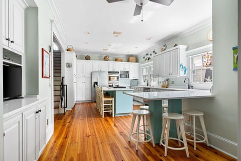 Kitchen fully stocked for all cooking and meal prep. Seating for 9.