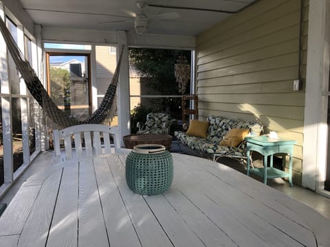 Screened room on lower level with two ceiling fans , perfect for outdoor dining