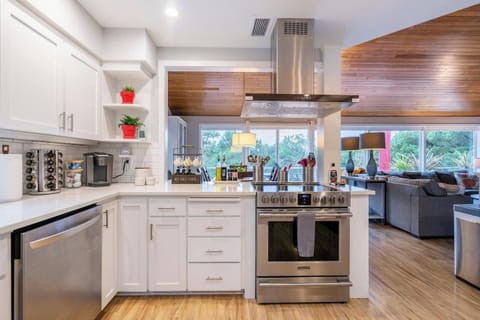 Cook, gather, and unwind in this bright, fully stocked kitchen — complete with stainless steel appliances, an induction range, and everything you need for family meals or morning coffee