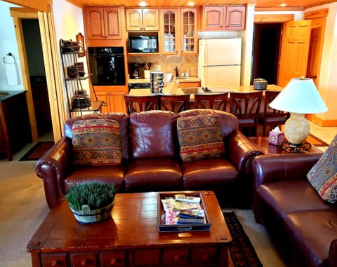 Family room/kitchen with king size bed with pocket doors and bath to the left
