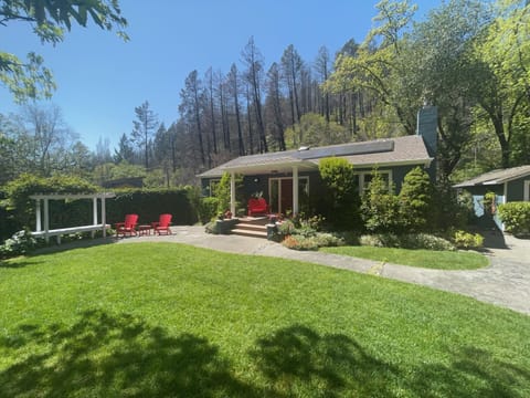 Peaceful, canyon and creek side setting. Comfortable front garden and entry. 