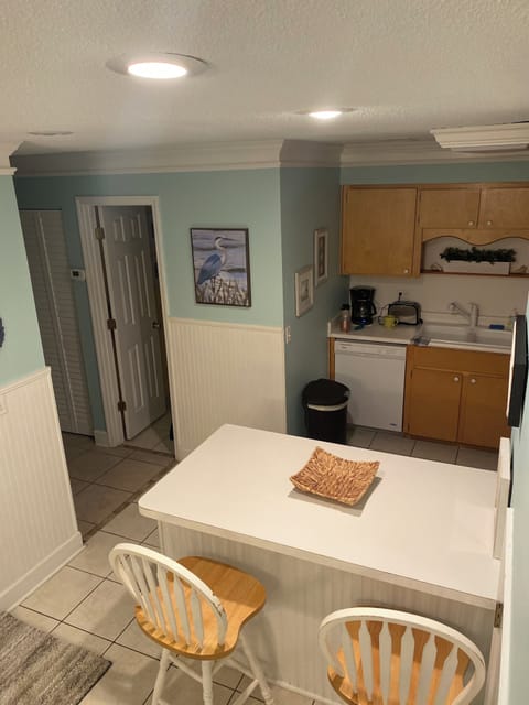 View of kitchen coming down stairs