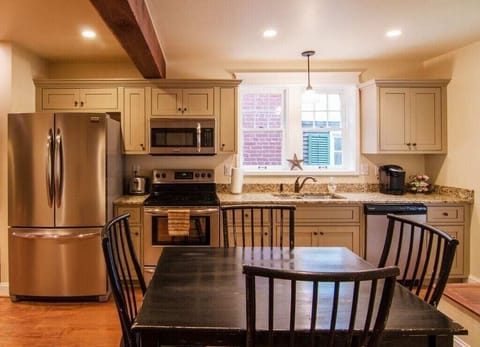 Full kitchen with seating for 6-8 (bench not shown).