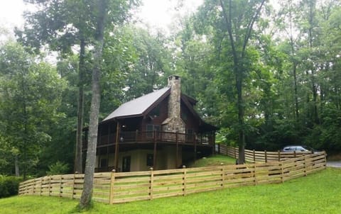 Cabin nestled in woods next to Big Brasstown Creek