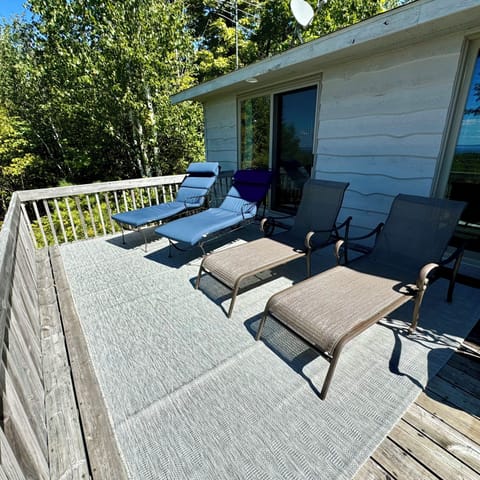 Relax with a good book on the lounge chairs on the spacious back deck.