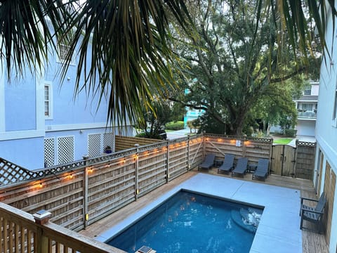 Private pool is lit up at night