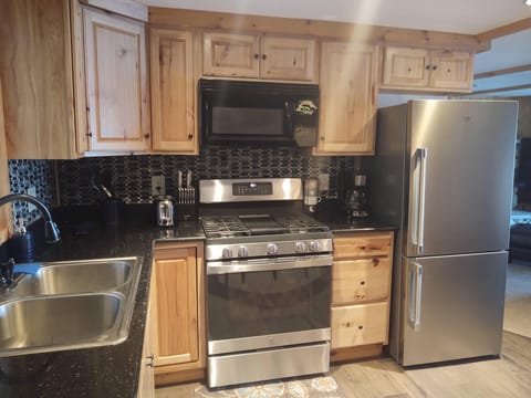 Fully stocked kitchen, with new stove and fridge in 2023.