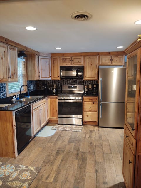 Fully stocked kitchen, with new stove and fridge in 2023.