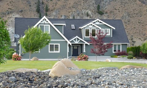 Front of house from far side of front lawn.