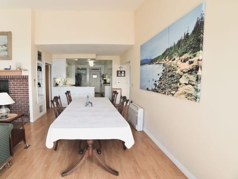Dining table with kitchen in the background