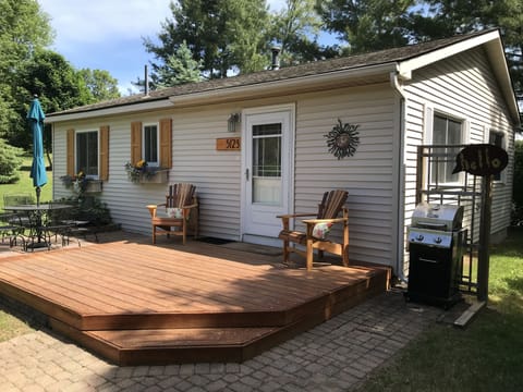 New cedar shutters, chairs, and address plate. Improvements every year! 