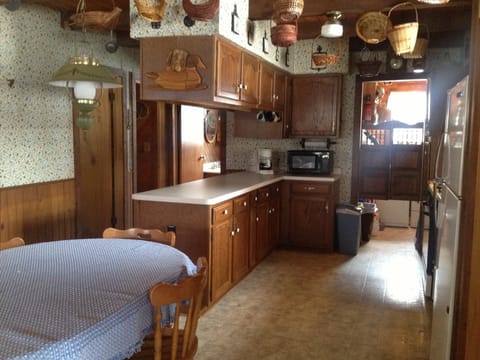 Kitchen and portion of dining area. Laundry area is in rear of photo