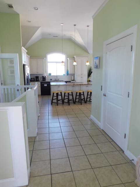 looking across the top floor, to the huge kitchen. 
 The elevator door is there.