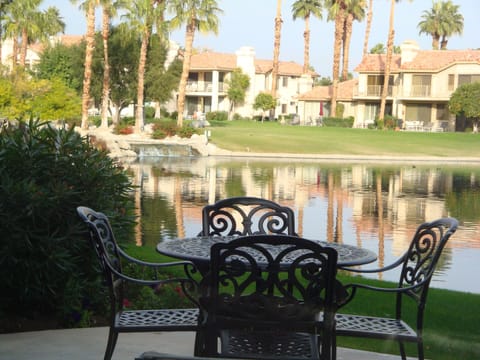 Patio dining with lake and waterfall view!