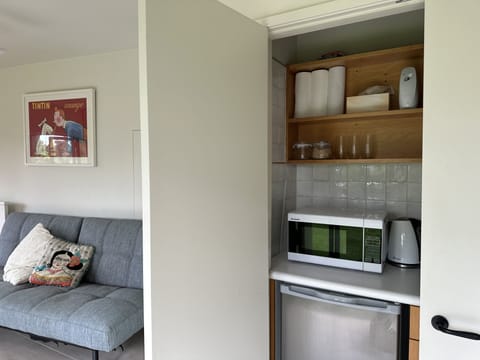 Self-contained downstairs space - Nespresso, microwave, fridge, toaster, jug.