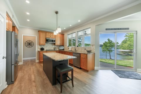 Well-stocked kitchen with central island and lots of counter space. Gas cook-top