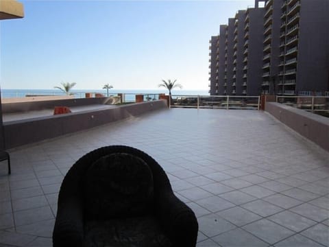 View from patio door also outside dining table for 8, bar table & chase lounges 