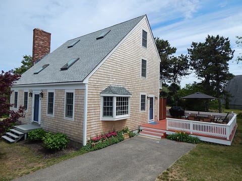Driveway for 2 cars and large deck for entertaining.