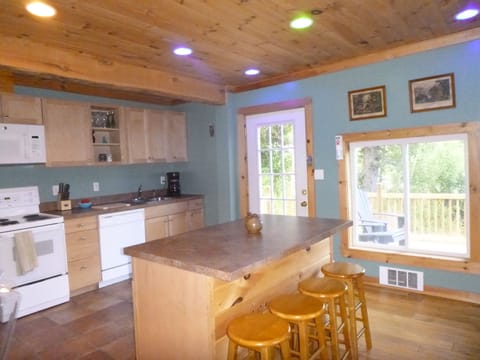 Seating at the island in the kitchen, easy for entertaining.