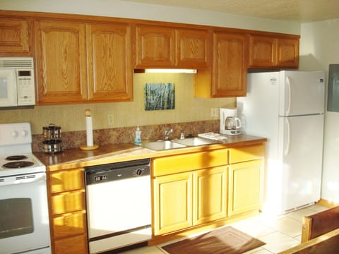 A full size fridge + extra large pantry provide lots of room for groceries.