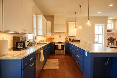 Includes induction oven, coffee maker, kettle, toaster, microwave, dishwasher