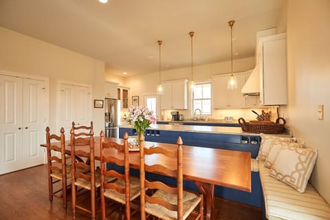 A mix of bench seating and chairs at the dining room table - fit as many as you 