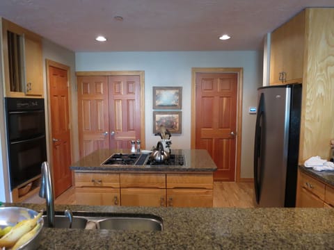 Gas stove and gas fireplace in kitchen.  Views of ski mtn and pond from kitchen.
