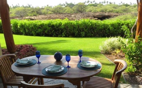 The lanai faces green space and lava tubes.