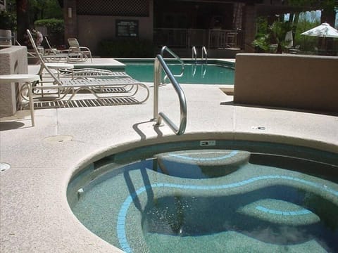 Both pools have an adjacent hot tub.